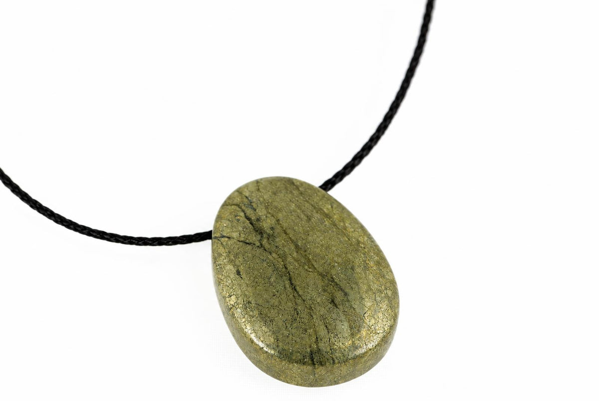 A polished, oval-shaped pendant with a golden-brown metallic surface hangs from a black cord against a white background.