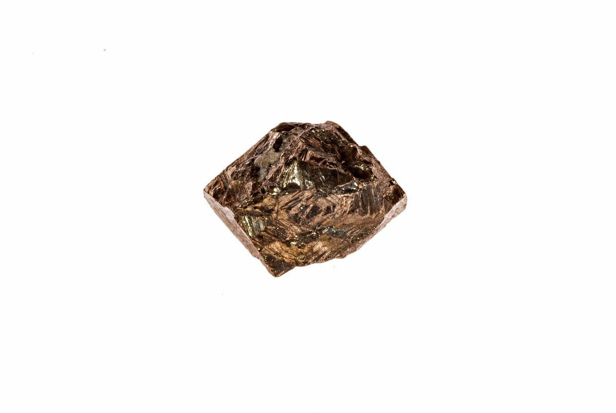 A small, metallic brown crystal with a rough, faceted surface sits on a white background.