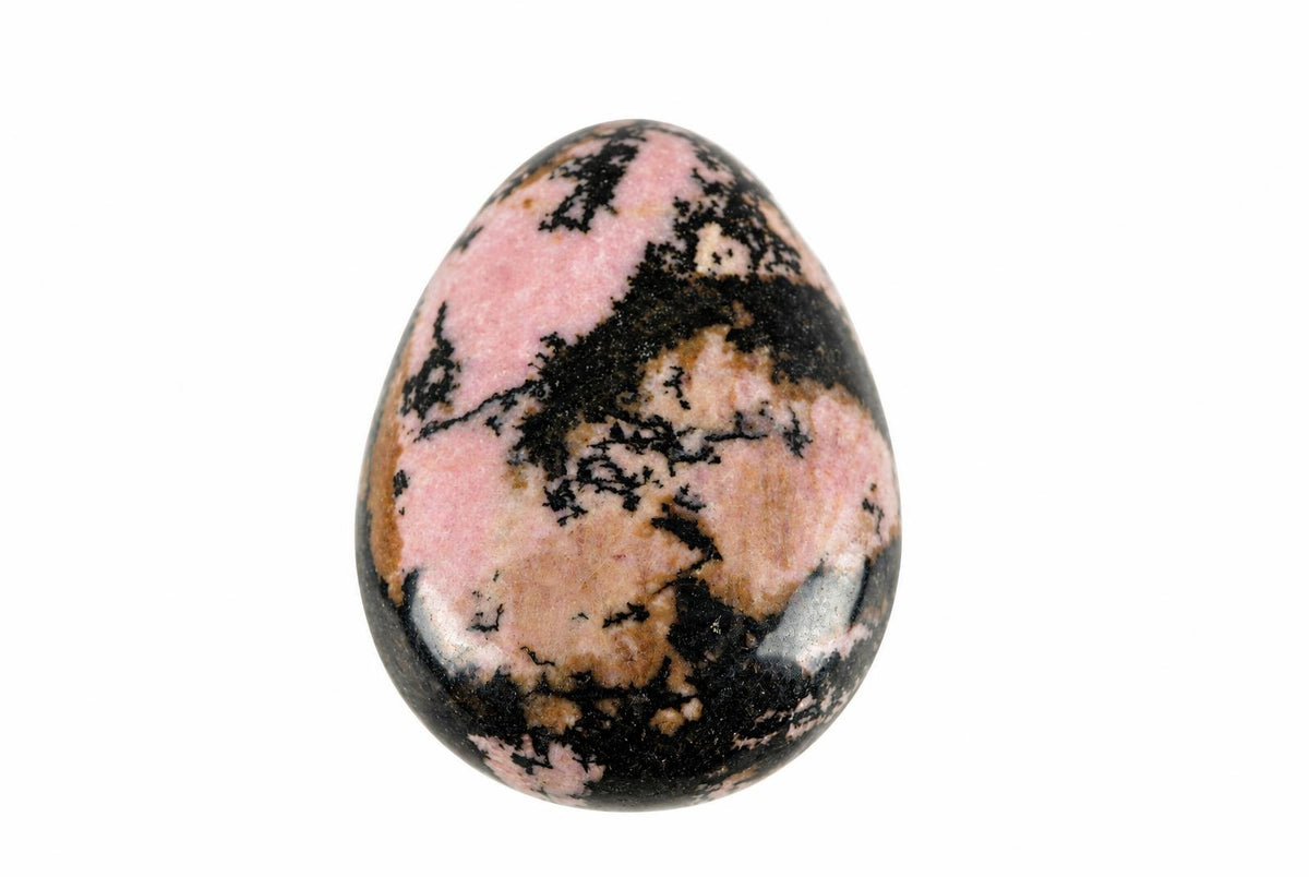 A polished, egg-shaped stone with pink, black and brown patterns on a white background.