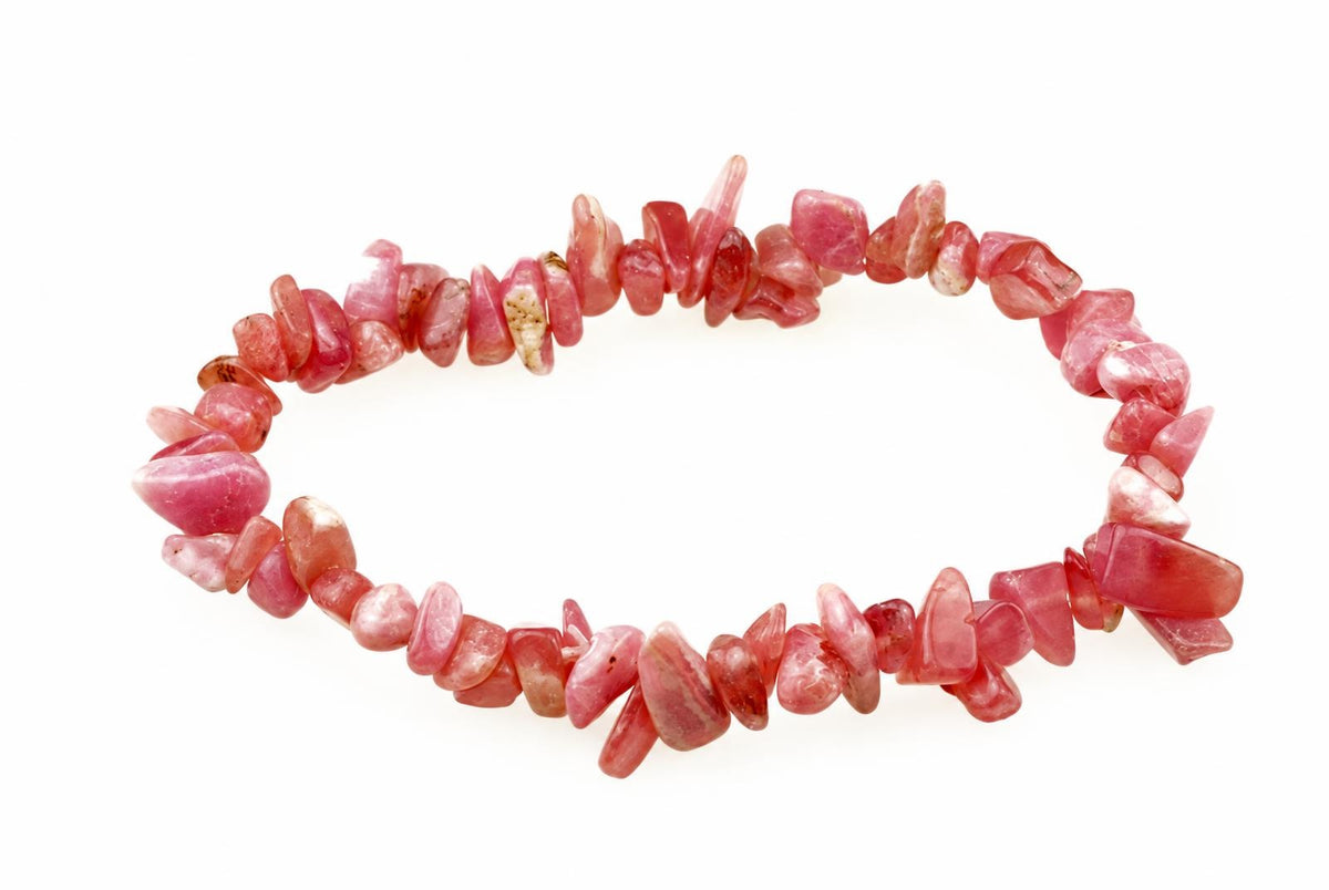 A bracelet made of irregular pink and red rodochrosite chips arranged in a circle on a white background.