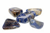 Five polished stones with deep blue, brown and grey tones on a white background.