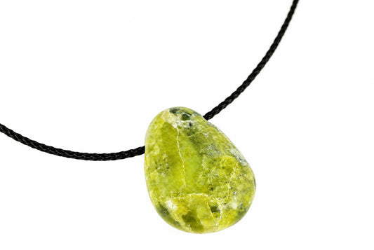 A green, teardrop-shaped pendant with a smooth surface hangs from a black cord against a white background.