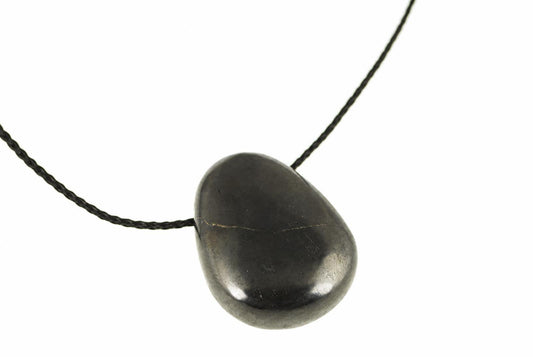A dark, smooth, teardrop-shaped pendant on a black cord against a white background.