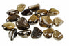 A collection of polished, smooth stones in dark brown and smoky grey tones arranged on a white surface.
