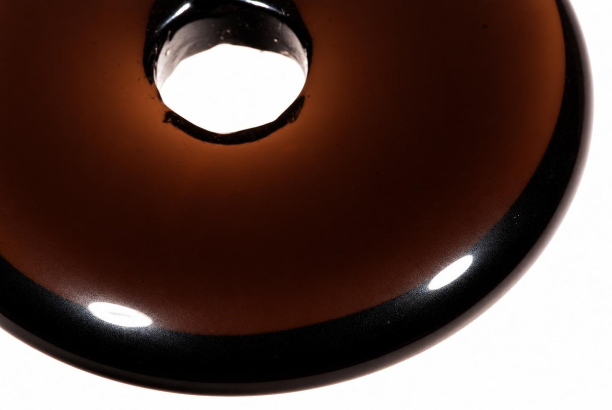 A close-up view of a dark brown, glossy pendant light with a black rim and a bright central opening.