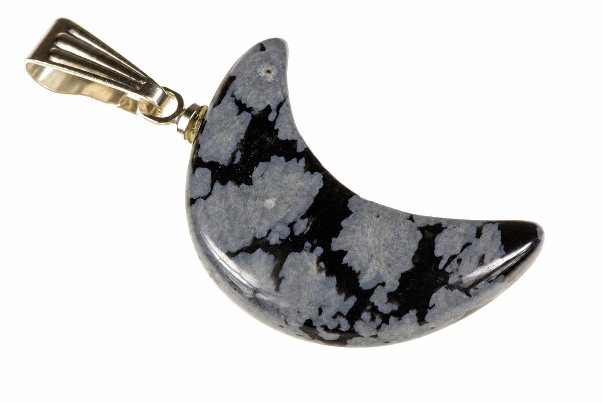 A crescent-shaped pendant with a polished dark surface featuring light grey and black patterns, attached to a silver-toned metal bail on a white background.