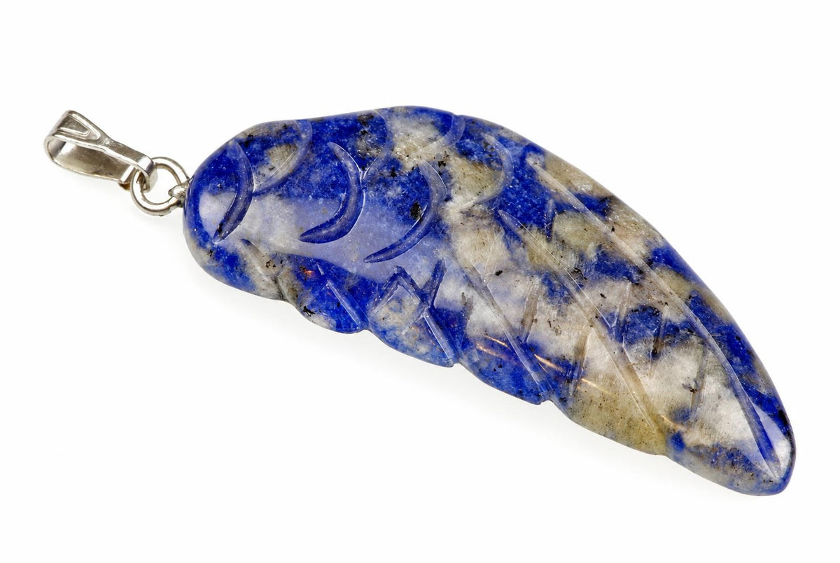 A silver-toned pendant with a carved sodalite stone shaped like a wing, featuring blue and white patterns on a pale surface.