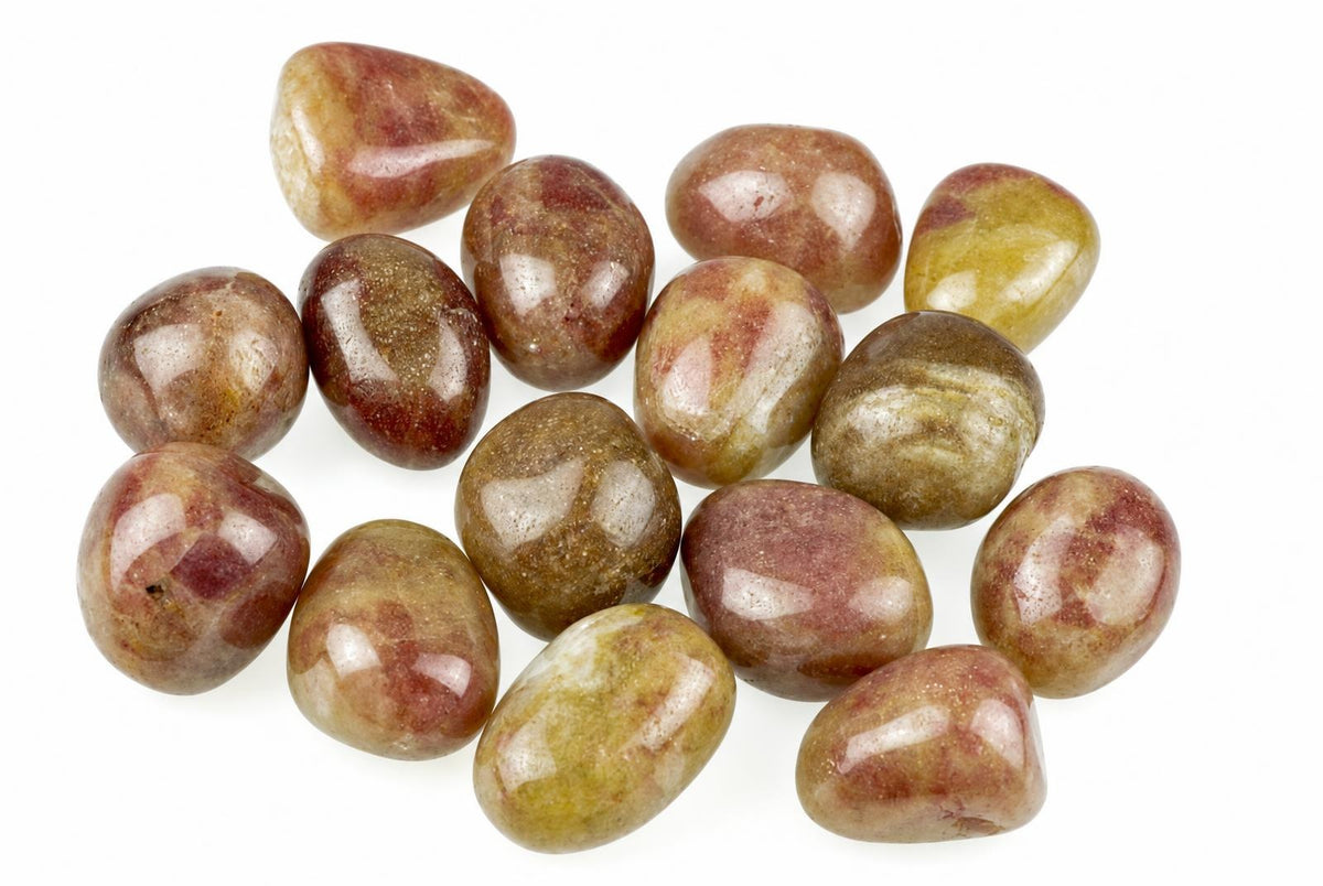 Twelve polished tumbled stones with red, brown and yellow patterns on a white surface.
