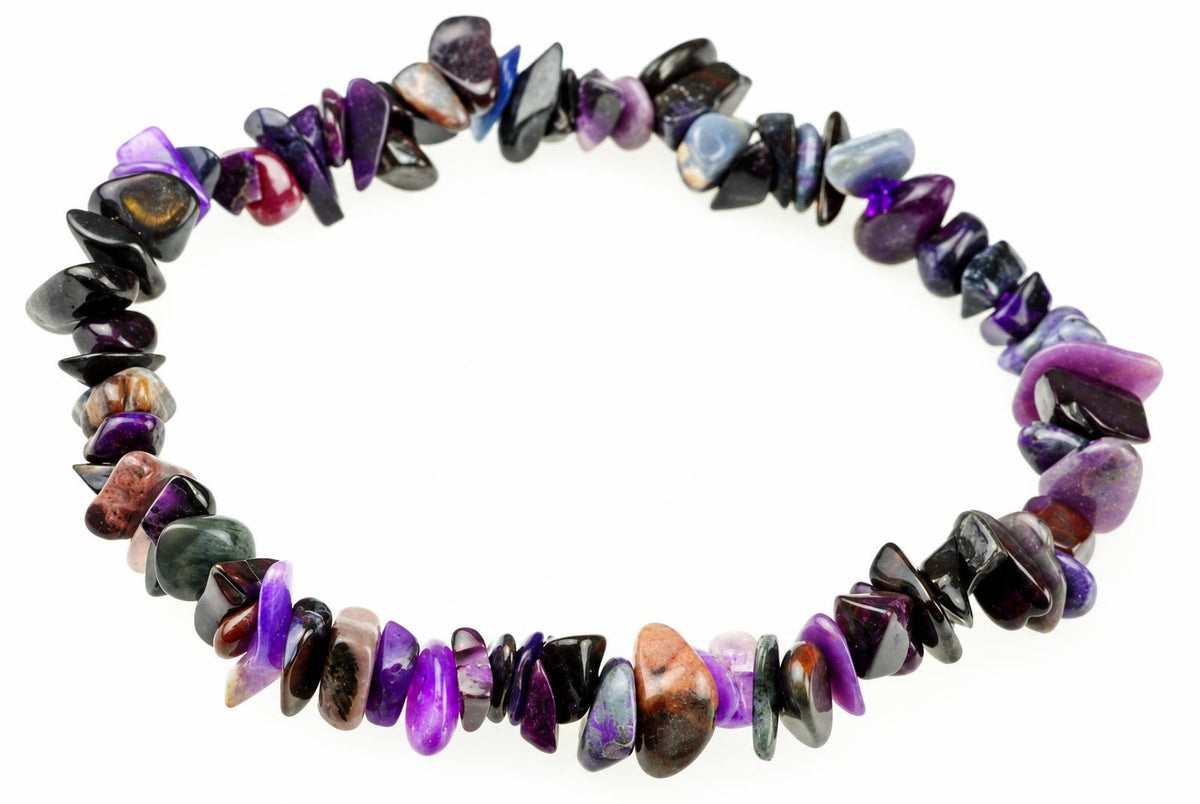 A bracelet made of polished, irregular chips in purple, black, blue, and brown tones arranged on a white surface.