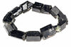 A bracelet made of raw, dark black schorl tourmaline crystals arranged in a circle on a white background.