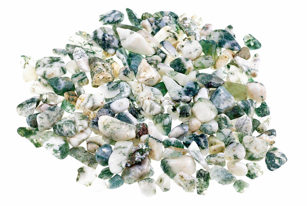 A pile of small, polished tree agate stones with white and green patterns on a white background.
