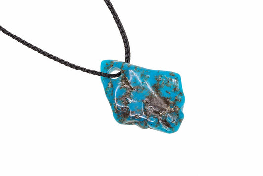 A turquoise pendant with dark brown matrix on a black cord, set against a white background.