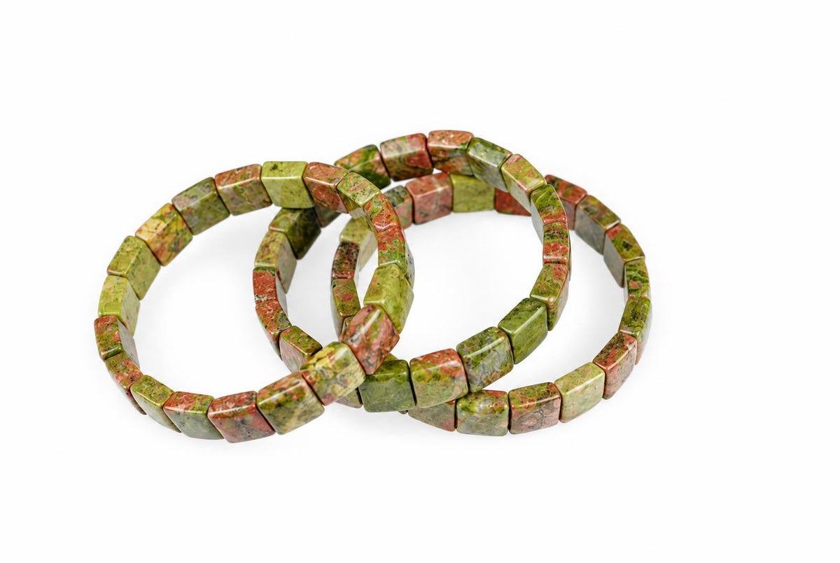 Three square Unakite bracelets with green and reddish-brown speckled stones arranged on a white surface.